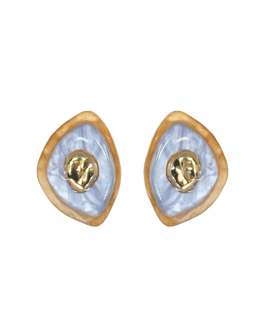 A pair of blue and gold acrylic earrings with a gold-plated brass centerpiece. Kolibri Collective