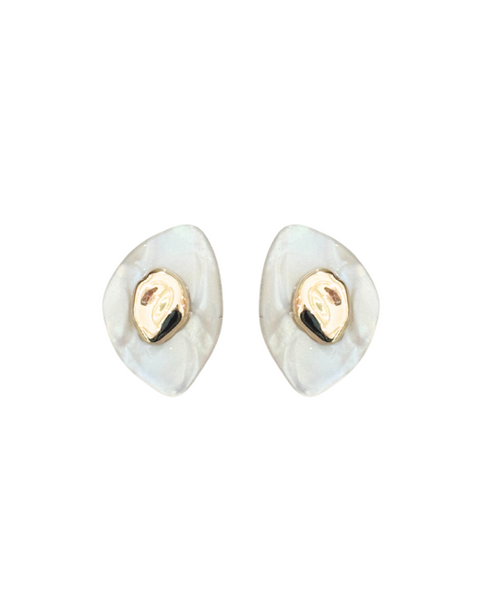 A pair of handmade acrylic mini earrings with a mountain silhouette and 14K gold-plated brass centerpiece. Kolibri Collective.